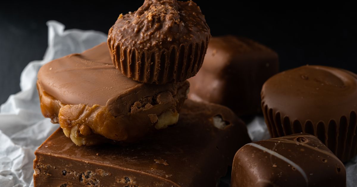 A delectable assortment of chocolate desserts including fudge and peanut clusters.